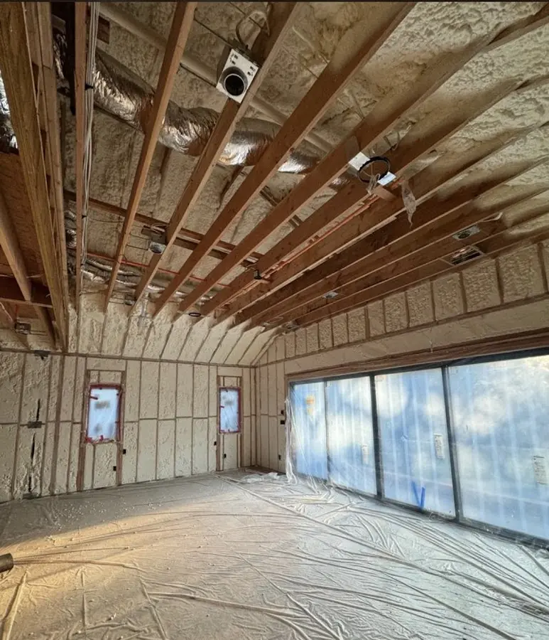 Interior walls and ceiling insulated with spray foam during new construction in Eastmont